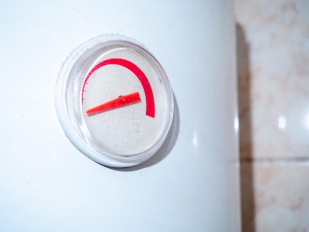 The dial on the water heater Appliance in the bathroom Titanium capacitance indicator primitive technique