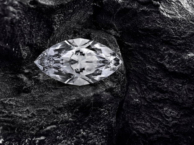 Diamond on black coal background