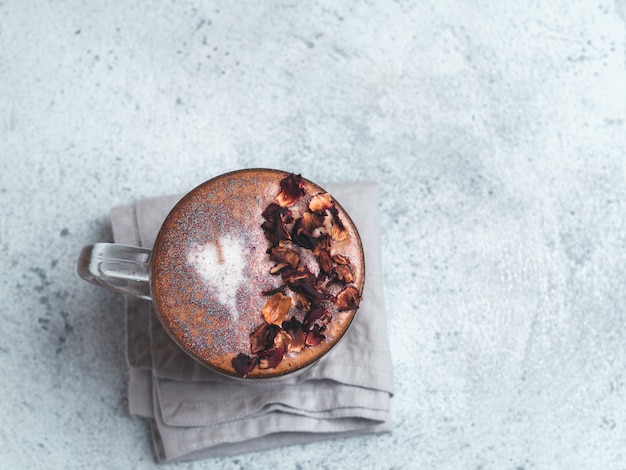 Diamond cappuccino coffee with dried rose petals