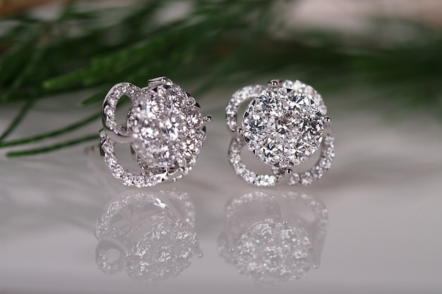 diamond earring on reflection background