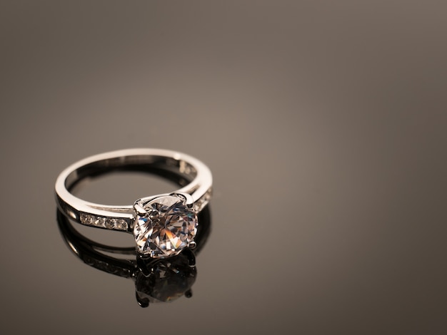 Diamond ring on black table