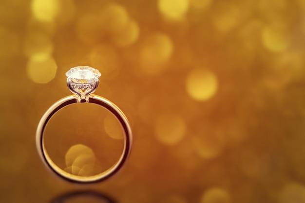 Diamond Ring on Golden Light Bokeh Background