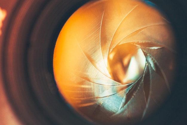 The diaphragm of a camera lens aperture. Selective focus with shallow depth of field.