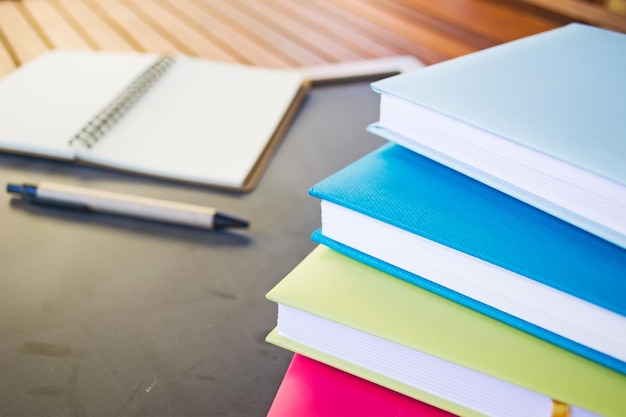 Diaries and pen on the blackboard