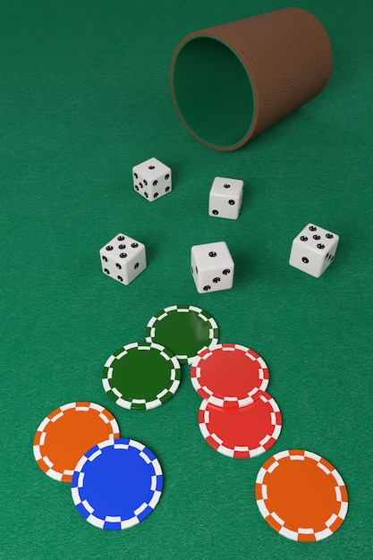 Dice and dice cup and chips on a green cloth.