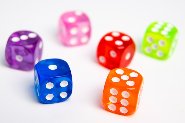 Dice of different colors isolated on a white .