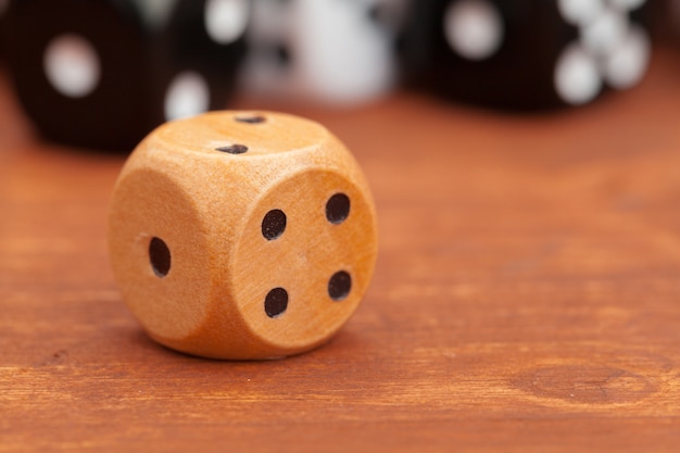 Photo dice on a wooden table.   business risk.