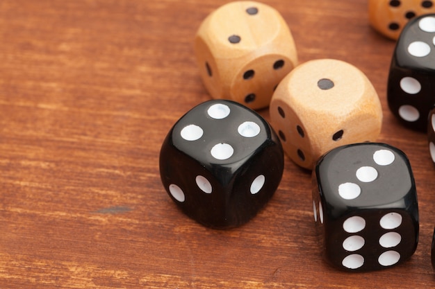 Dice on a wooden table. Concept for business risk.