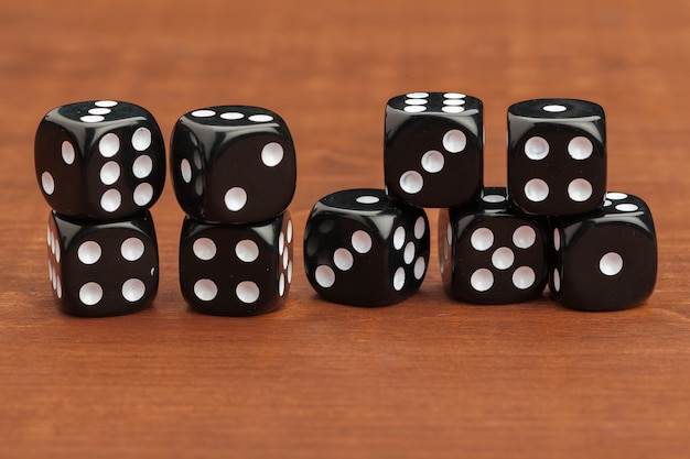 Dice on a wooden table. Concept for business risk.