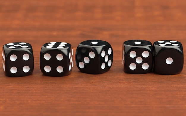 Photo dice on a wooden table.