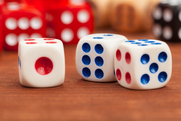 Dice on a wooden table. 