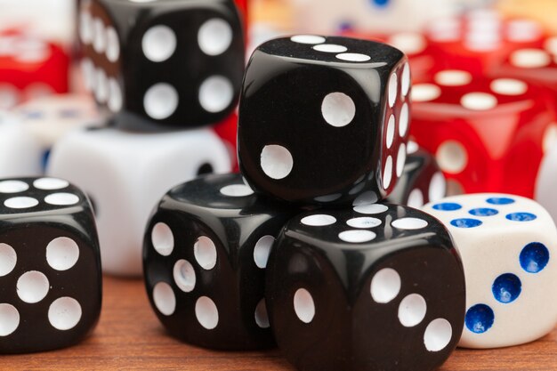 Dice on a wooden table. 