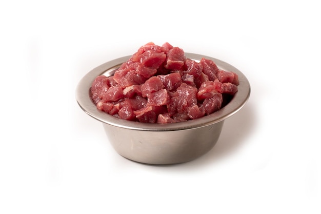 Diced pork or beef meat in a bowl Wet animal feed