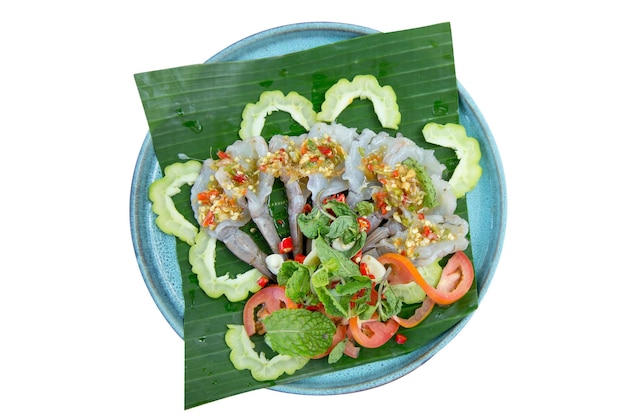 Photo die cut of shrimp in fish sauce on banana leaf on white isolated