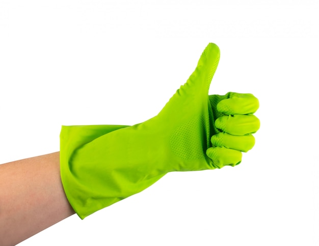 Dien groene beschermende rubberhandschoen in die op witte achtergrond met het knippen van weg wordt geïsoleerd. Goedgekeurde gehandschoende hand duimen omhoog en ok laten zien