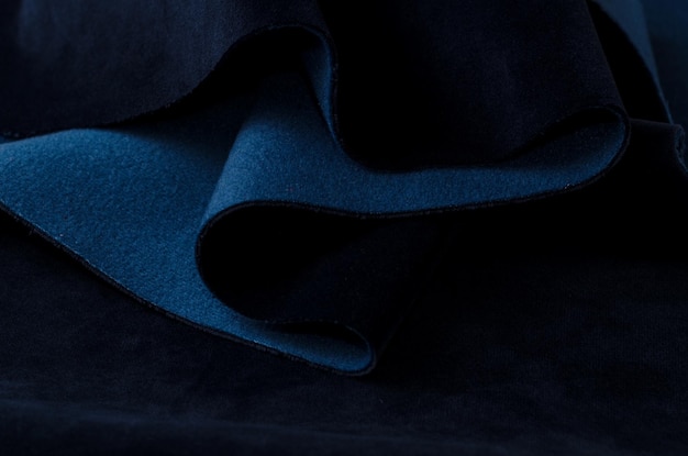 Diepblauw fluweel textiel Stofstructuur achtergrond