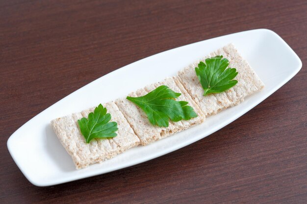 Diet bread with parsley on a plate