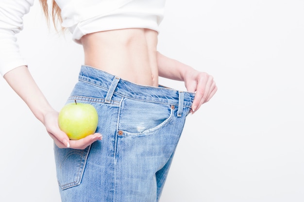 Diet concept and weight loss Woman In Oversize jeans