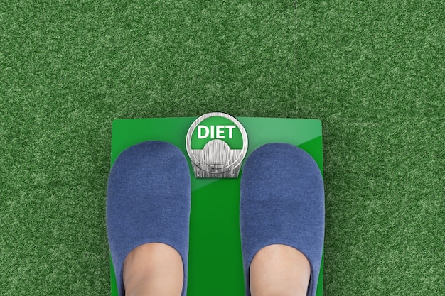 Diet concept with feet standing on weight scales
