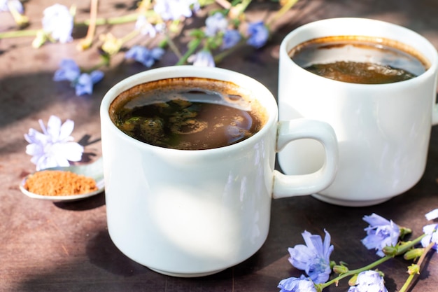 Diet drink chicory in a cup  coffee substitutes powder and fowers Herbal beverage Selective focus