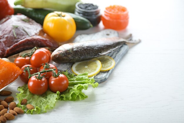 Diet food on a light wooden background