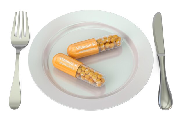 다이어트 및 건강한 식사 개념 비타민 K 캡슐 3D 렌더링이 포함된 플레이트