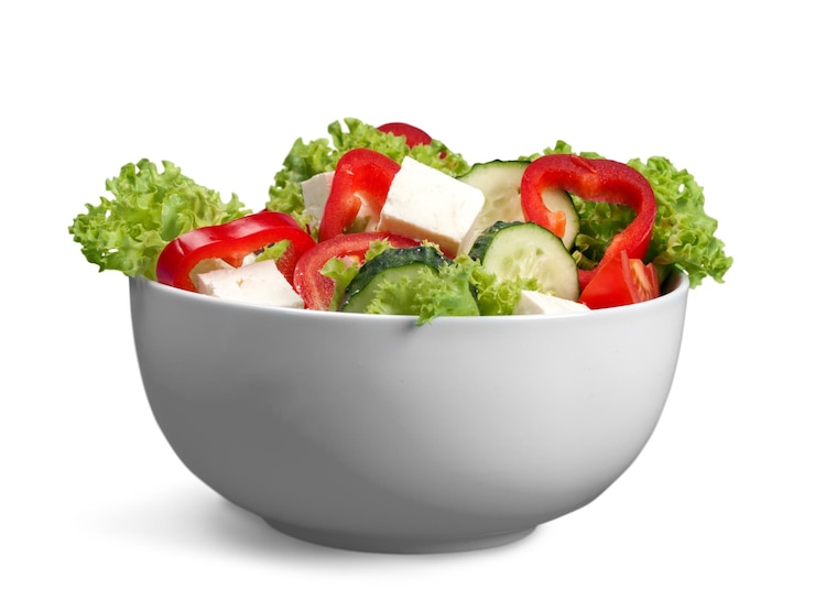 Photo diet meal. vegetables salad in a bowl with digital weight scale