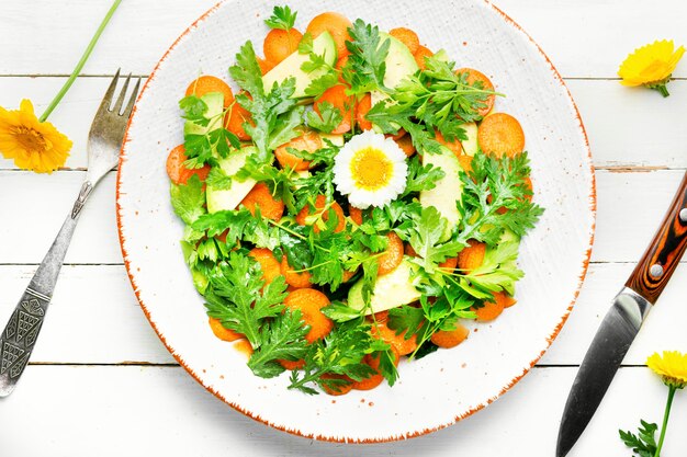 Diet salad with chrysanthemum leaves and avocado