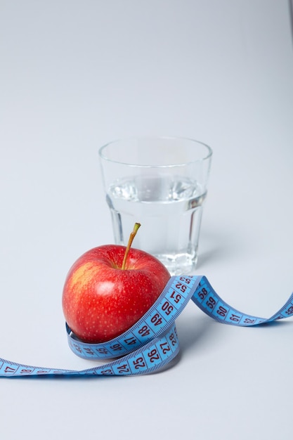 Diet and weight loss healthy lifestyle composition with measuring tape