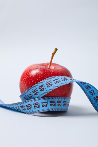 Diet and weight loss healthy lifestyle composition with measuring tape