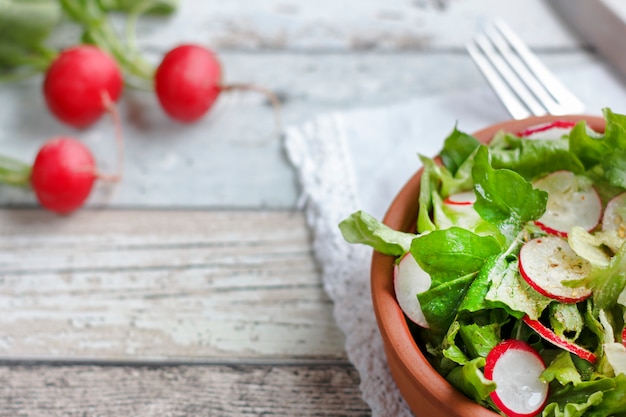 Dietary food for fitness. Radish, Lettuce and Arugula Salad