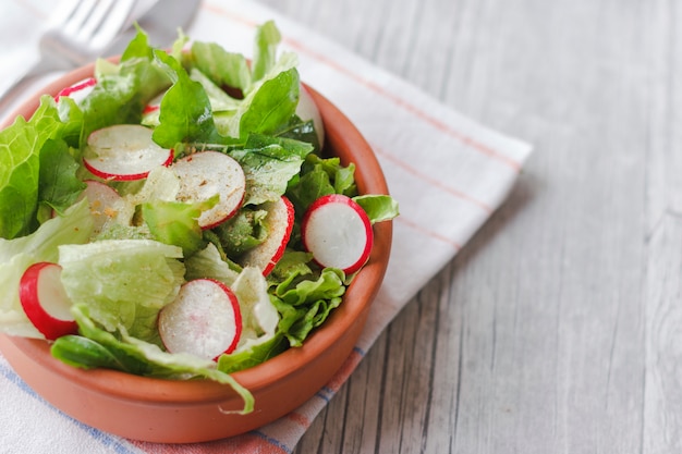 Dietary food for fitness. Radish, Lettuce and Arugula Salad