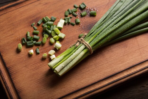 Dietary nutrition. Preparation of salad with green onion.