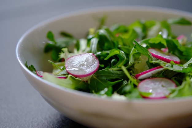 Dietary salad with arugula and radish. Diet. Vegetarian salad.