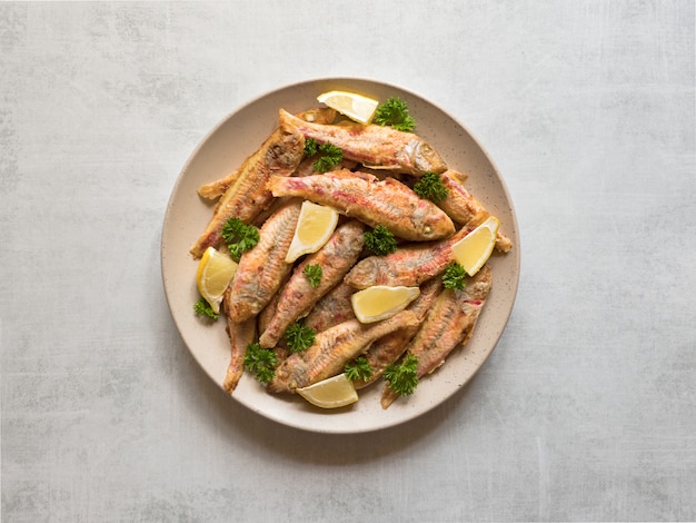 Dietary surmullet fish. Fried fish in a plate