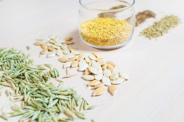 Differen dry seeds for a folk medicine on white background