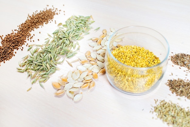 Differen dry seeds for a folk medicine on white background