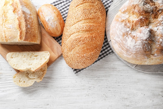 Different bakery products on wooden table