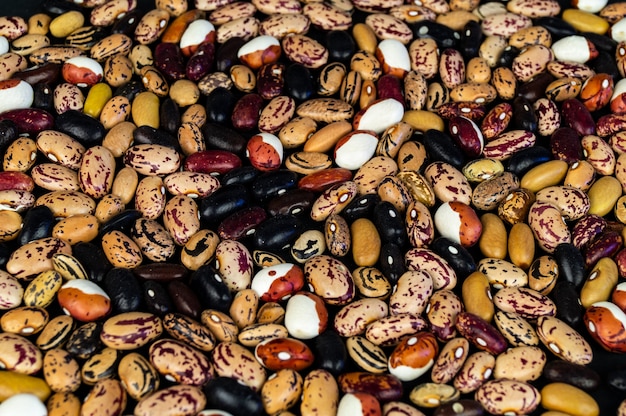 Different beans scattered on the table