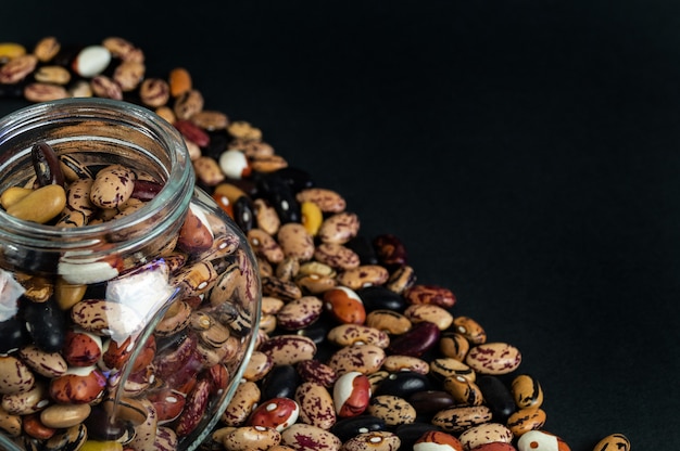 Different beans scattered on the table