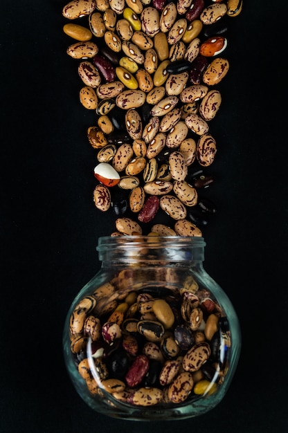 Different beans scattered on the table