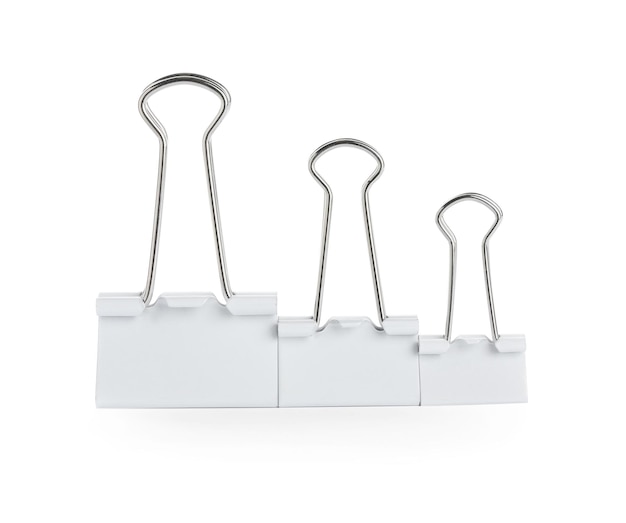 Different binder clips on white background Stationery item