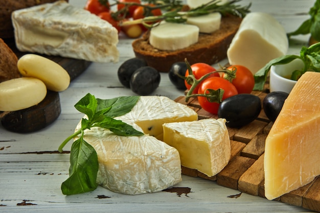 Different cheeses on table