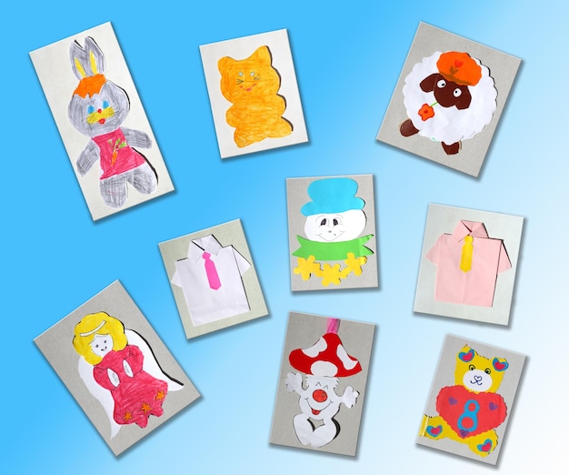 Different children's pictures isolated on the light blue background