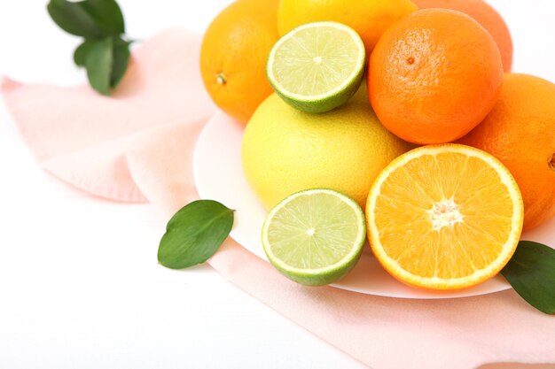 Different citrus and juicy slices on a colored background place to insert text