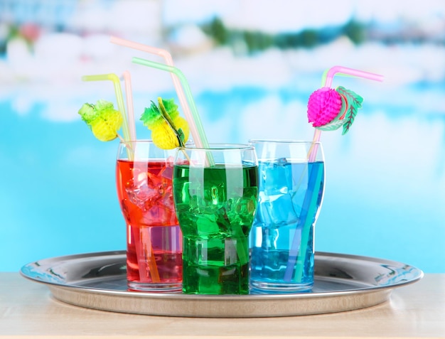 Different cocktails on bright background