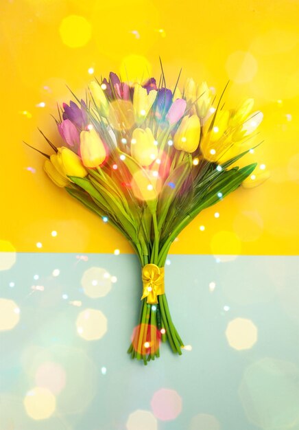 Different color tulips on background