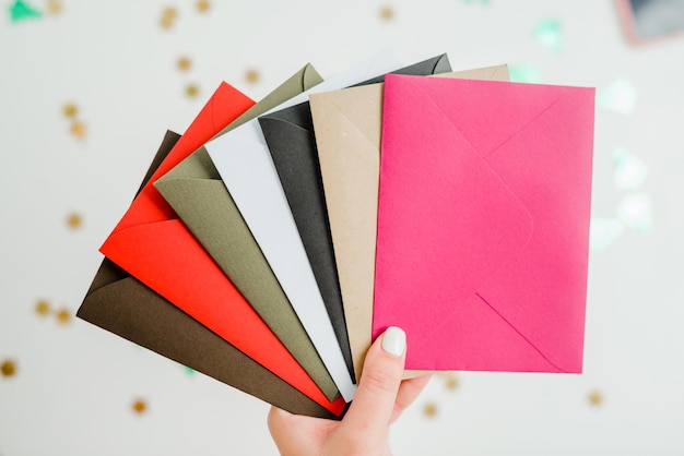 Photo different colored envelopes on the table