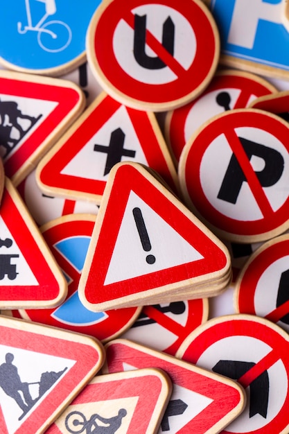 Different colored traffic signs on the white background