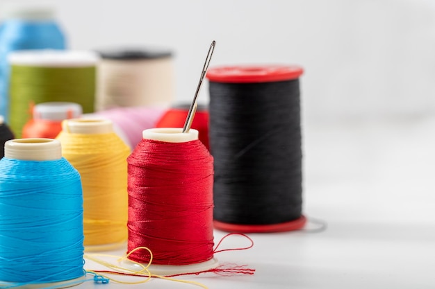 Different colored yarn on white background Close up Selective Focus